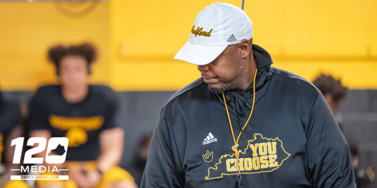Head Coach Dennis Johnson addresses his team at halftime during Woodford County’s 52-12 win over South Oldham at Community Stadium, Versailles, October 3, 2025.