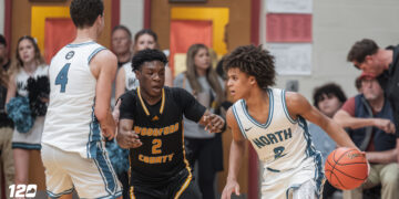 North Oldham's Pierre Rondo Jr. looks for a driving lane during the 8th Region Semifinals.